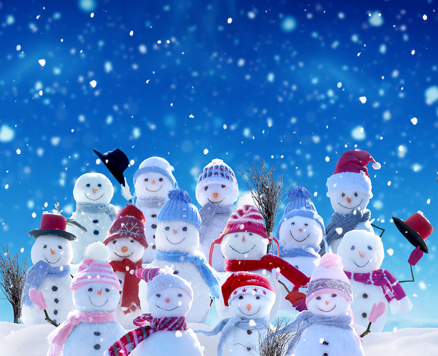 Merry Christmas and happy New Year greeting card with copy-space.Many snowmen standing in winter Chr Merry Christmas and happy New Year greeting card with copy-space.Many snowmen standing in winter Chr